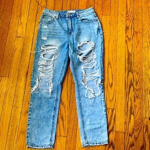 jean with fashionable tears